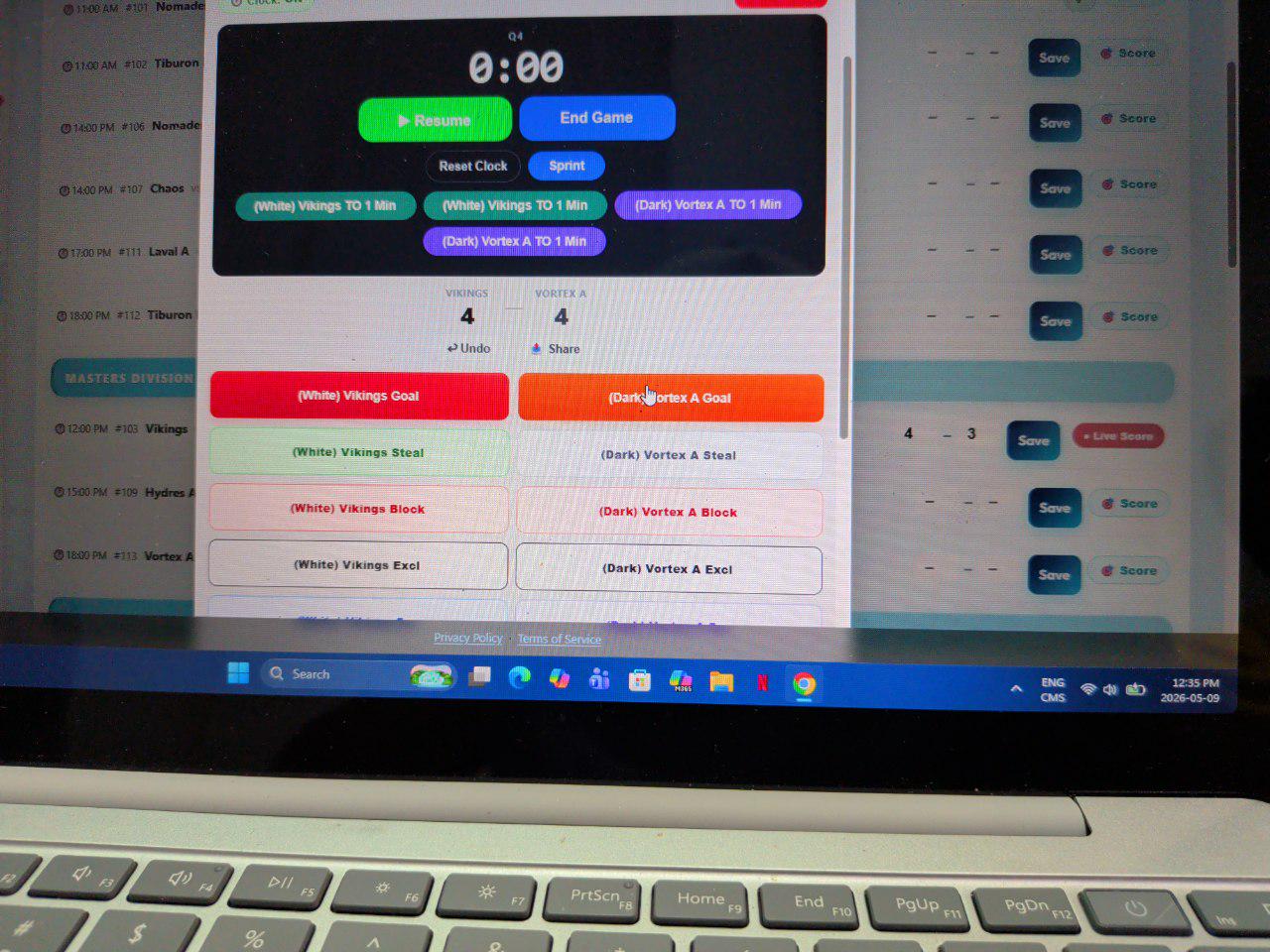 Real laptop at the scoring desk showing the Eggbeater scorer with Vikings and Vortex A tied 4–4